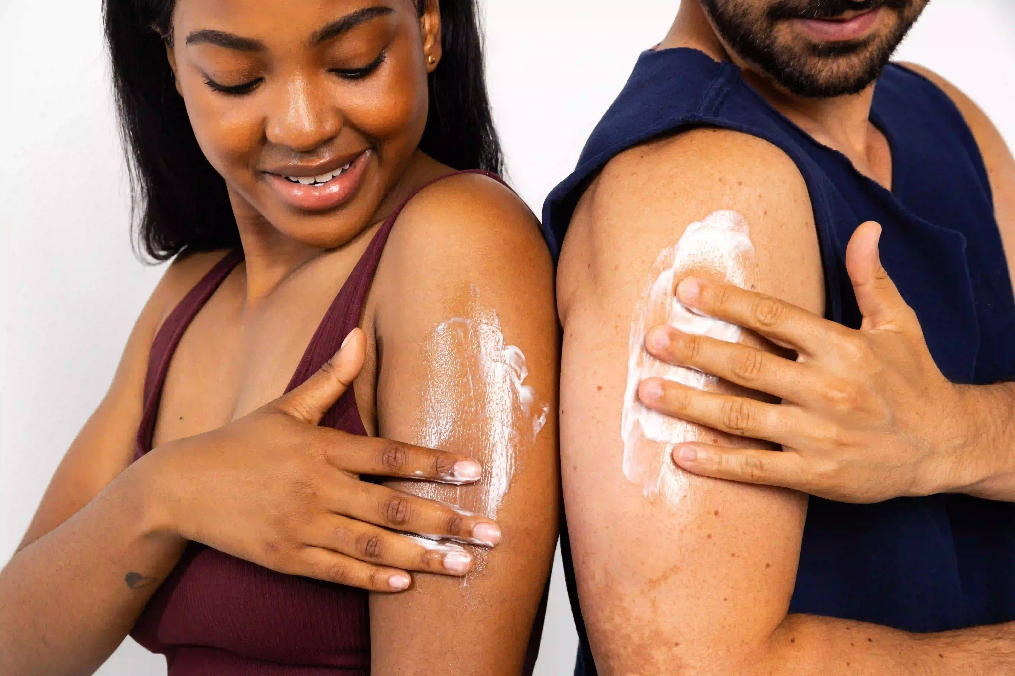 Woman using Lubriderm to moisturize her extra dry skin
